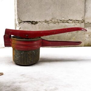 Vintage Red Enamel Potato Ricer Press Metal Perforated Cup Mid Century